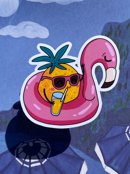 pineapple flamingo floatie on blue background