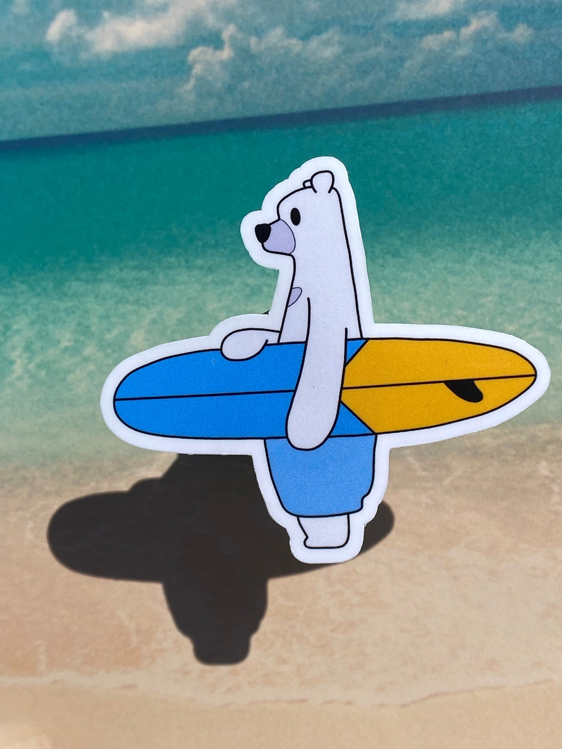polar bear surfing sticker with beach background