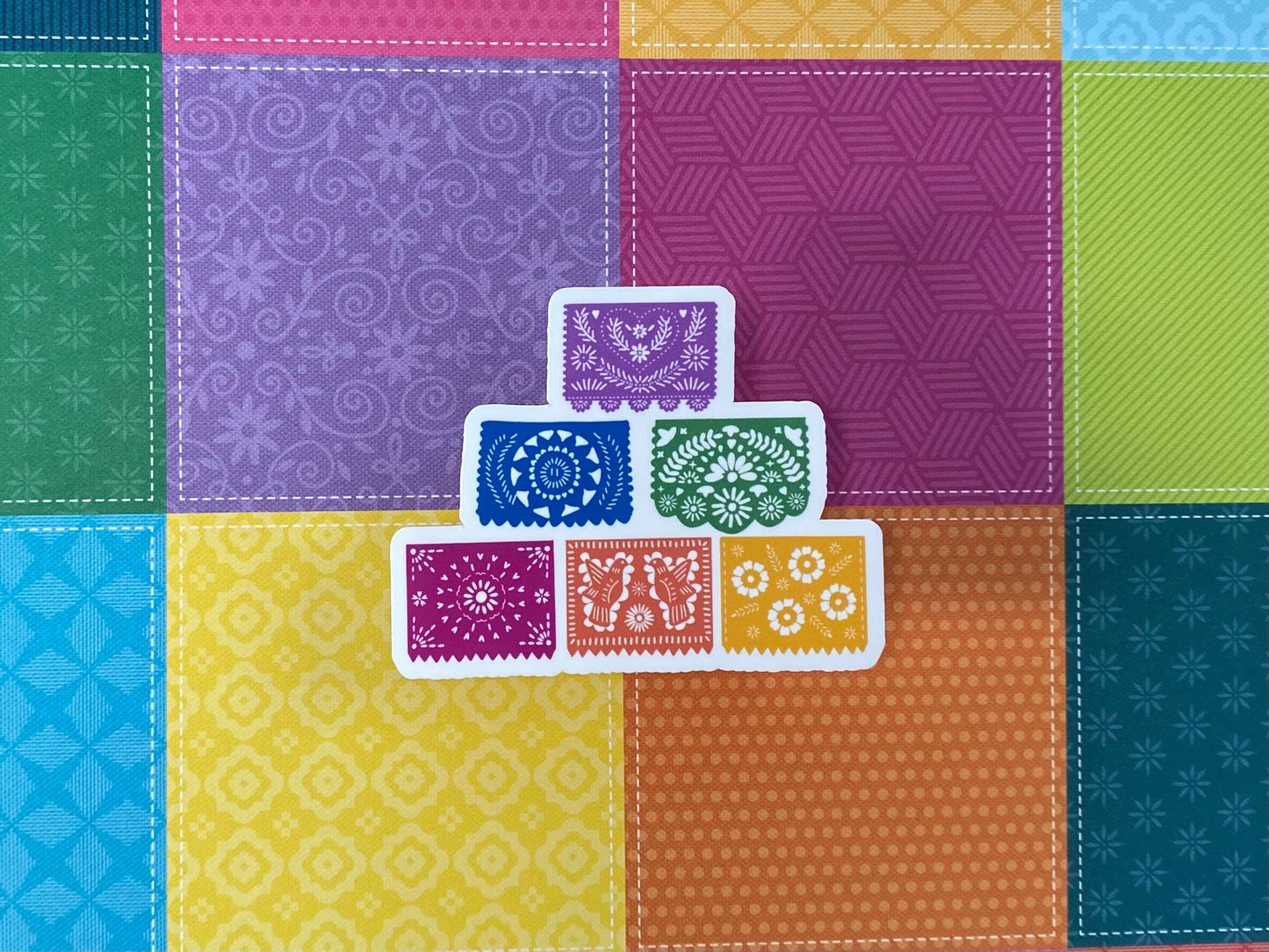 papel picado sticker on colorful background