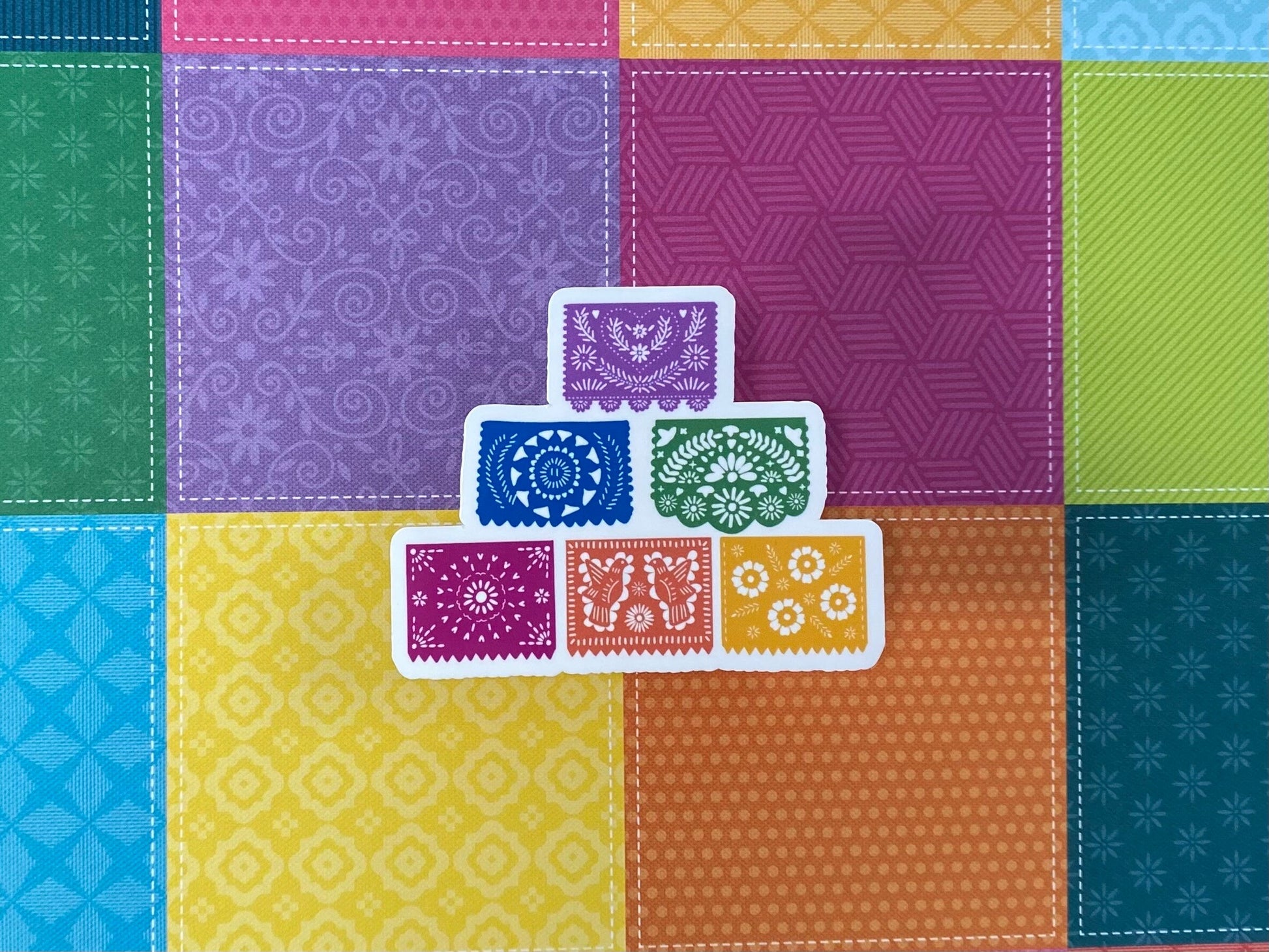 papel picado sticker on colorful background