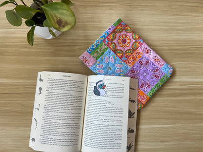 Patchwork book sleeve under book on desk